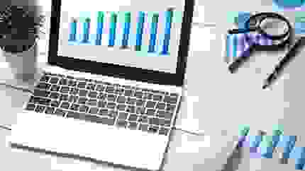 a laptop screen showing a graph 